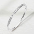 Rhodium Plated CZ Pave Twist Hinged Bangle Bracelet