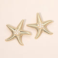 Bold Pearl Center Textured Starfish Statement Earrings