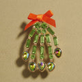 Bow Accent Glass Stone Skeleton Hand Pin Brooch